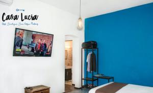 a bedroom with a bed and a picture on the wall at Casa Lucia in Monterrey