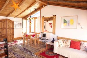 A seating area at Holidays in Tarajalejo - home office with sea view