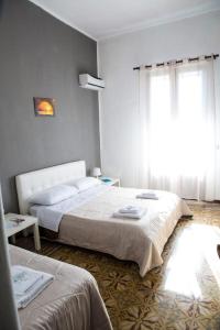 Postel nebo postele na pokoji v ubytování Stanze Di Leo