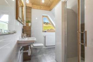 a bathroom with a sink and a shower at Willa Pitoniówka z sauną, Netflix oraz Xbox one in Kościelisko +33 photos