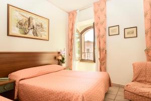 Postel nebo postele na pokoji v ubytování Hotel San Pietro + 37 fotografií