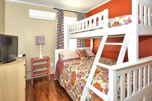 a bedroom with a bunk bed and a desk at Happy House in Ocean City