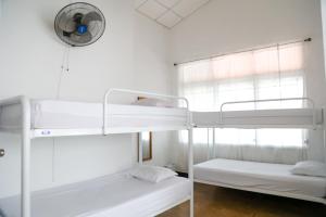 Postel nebo postele na pokoji v ubytování Hostal Villa Grande