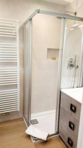 a shower with a glass door in a bathroom at MAISON MY LIFE in Bolzano +12 photos