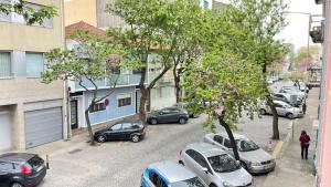 a group of cars parked on a city street at MyTrip Porto in Matosinhos