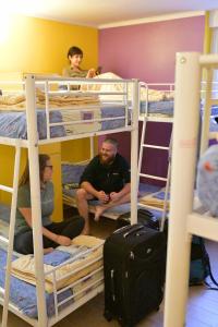 a group of people sitting on bunk beds at Outlanders Tribe Hostel in Split