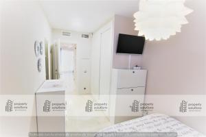 Posteľ alebo postele v izbe v ubytovaní Los patos I Apartamentos - Segunda línea de playa - PARKING GRATIS - PISCINA