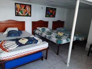 Säng eller sängar i ett rum på Hotel Andaluz