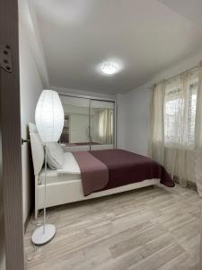Katil atau katil-katil dalam bilik di Renting Solutions Iulius Mall