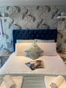 A bed or beds in a room at The Bayridge Guest House 