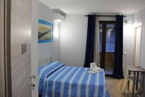 Postelja oz. postelje v sobi nastanitve B&B Blue Marine Licata