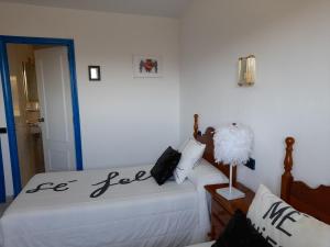 a bedroom with two beds with the words be ego at Hostal "Los Chanos el Ruso" in Galende