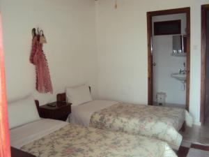 Postel nebo postele na pokoji v ubytování Vassilis Guesthouse