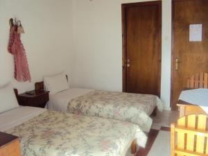 Postel nebo postele na pokoji v ubytování Vassilis Guesthouse