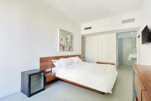 Un pat sau paturi într-o cameră la Sonder La Casa del Sol