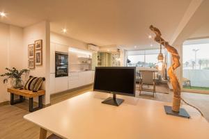 a living room with a television on a table at K-SPACE by Nuka Homes in Jávea
