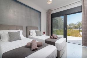Posteľ alebo postele v izbe v ubytovaní Grande Amore Villa + 27 fotografií