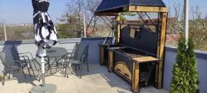 a bird house sitting on top of a patio at Lux Vila Aleksandar in Sremska Kamenica