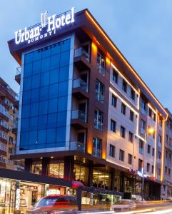 un edificio con un cartel en la parte delantera en Urban Hotel Bomonti, en Estambul