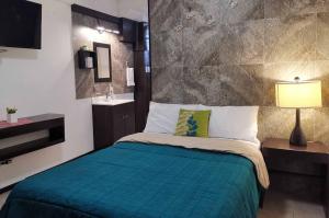 Postel nebo postele na pokoji v ubytování Cabo Tortuga Hotel Boutique