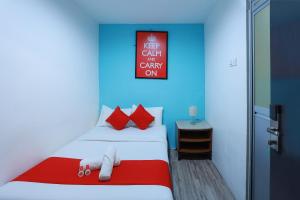 Hotel Aman- Nilai & KLIA客房内的一张或多张床位