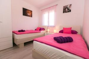 Postel nebo postele na pokoji v ubytování House Pink
