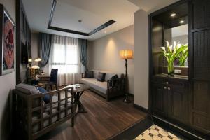 Postel nebo postele na pokoji v ubytování Lotus Aroma Sapa Hotel