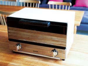 a toaster oven sitting on top of a table at CHULAX OKINAWA YOMITAN【Designer Condominium Hotel】 in Yomitan