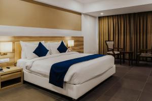 Regenta Central Somnath, Bhalpara客房内的一张或多张床位
