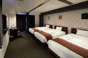 Postel nebo postele na pokoji v ubytování HOTEL BRILLER Kyoto Station South
