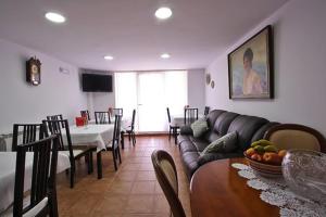 a living room with a couch and a table at Quintana 23 in Suances