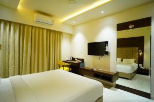 TV a/nebo společenská místnost v ubytování Orange Tree Hotels