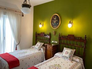 Ένα ή περισσότερα κρεβάτια σε δωμάτιο στο Casa de Campo con Piscina en Sevilla en los Palacios y Villafranca