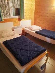 Tempat tidur dalam kamar di Au Soleil de Picardie