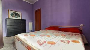 Postel nebo postele na pokoji v ubytování La Casa Colorata