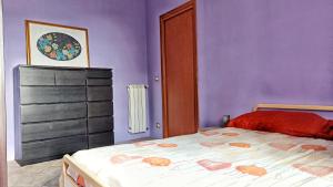 Postel nebo postele na pokoji v ubytování La Casa Colorata