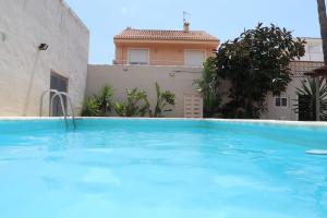 Casa familiar en primera linea de playa Puzol con piscina ...