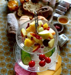 two plates of food with fruit on a table at B&B de Scherpenhof in Leur
