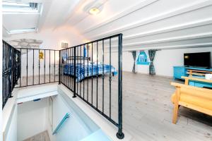 a room with a balcony with a bed in it at Apartments & Rooms La casa Barbaro in Rovinj