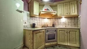 Kuchyň nebo kuchyňský kout v ubytování La Casa Colorata