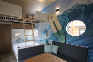 Predel za sedenje v nastanitvi Tiny Wave Tiny House auf dem Campingplatz Strandgut
