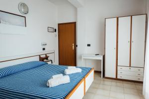 Postel nebo postele na pokoji v ubytování Hotel Montecarlo