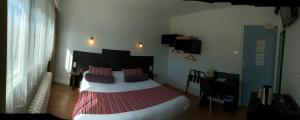 מיטה או מיטות בחדר ב-Cit'Hotel Atlantis