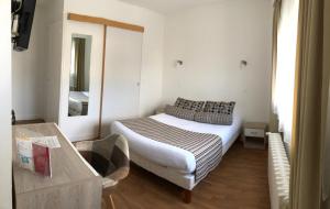 מיטה או מיטות בחדר ב-Cit'Hotel Atlantis