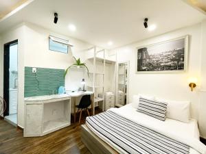 Ein Bett oder Betten in einem Zimmer der Unterkunft Street View Hotel & Apartment