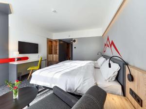 Krevet ili kreveti u jedinici u okviru objekta ibis Styles Nowy Targ