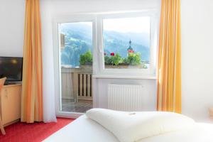 Łóżko lub łóżka w pokoju w obiekcie Sun Valley - Wildschönau