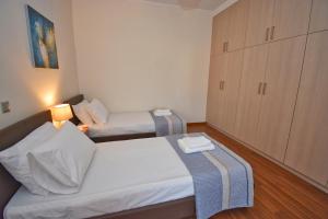 Postel nebo postele na pokoji v ubytování Casa D' Oro Corfu