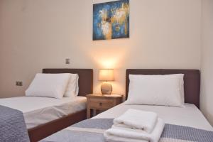 Postel nebo postele na pokoji v ubytování Casa D' Oro Corfu