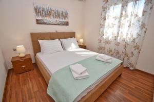 Postel nebo postele na pokoji v ubytování Casa D' Oro Corfu